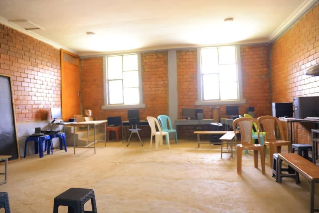 Spacious computer training lab equipped with modern desktop workstations and daylight seating