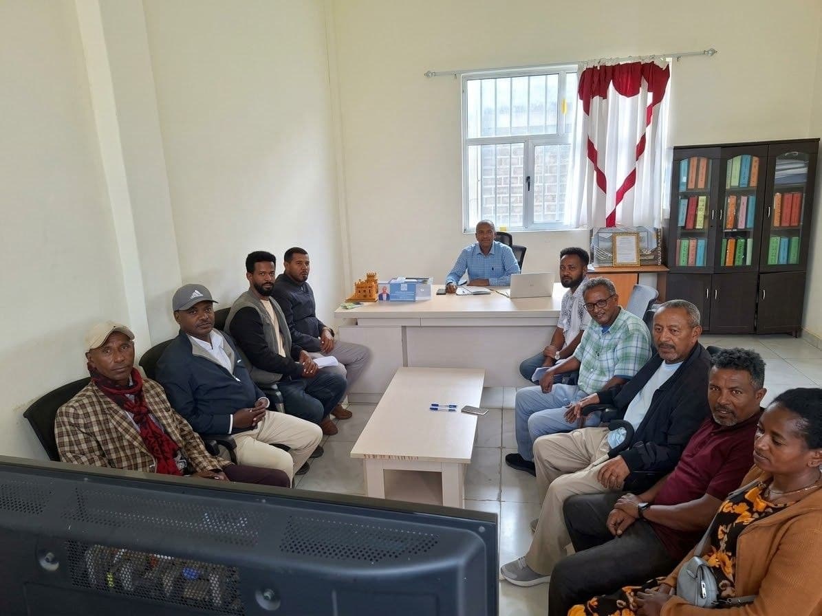 Erkab leadership and community partners holding an organizational planning session in the center office