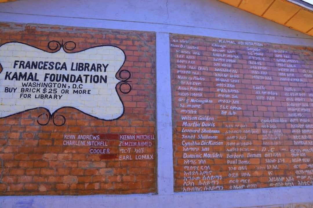 Francesca Library and Kamal Foundation commemorative donor inscription wall on brick masonry