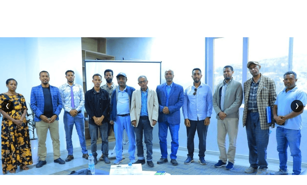 Group portrait of the Erkab instructors, project coordinators, and community leaders at the training facility